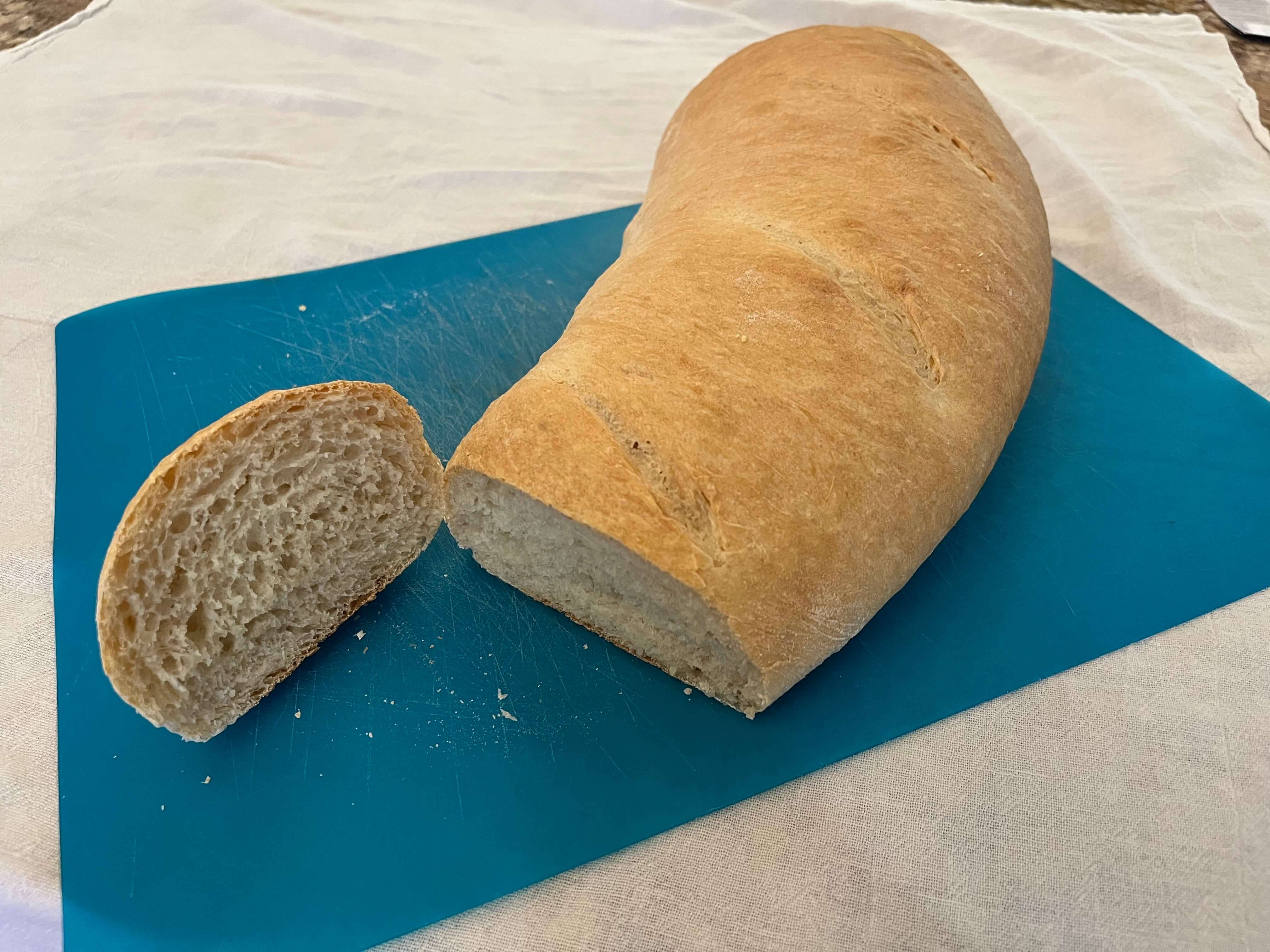 Sliced French bread on a cutting board