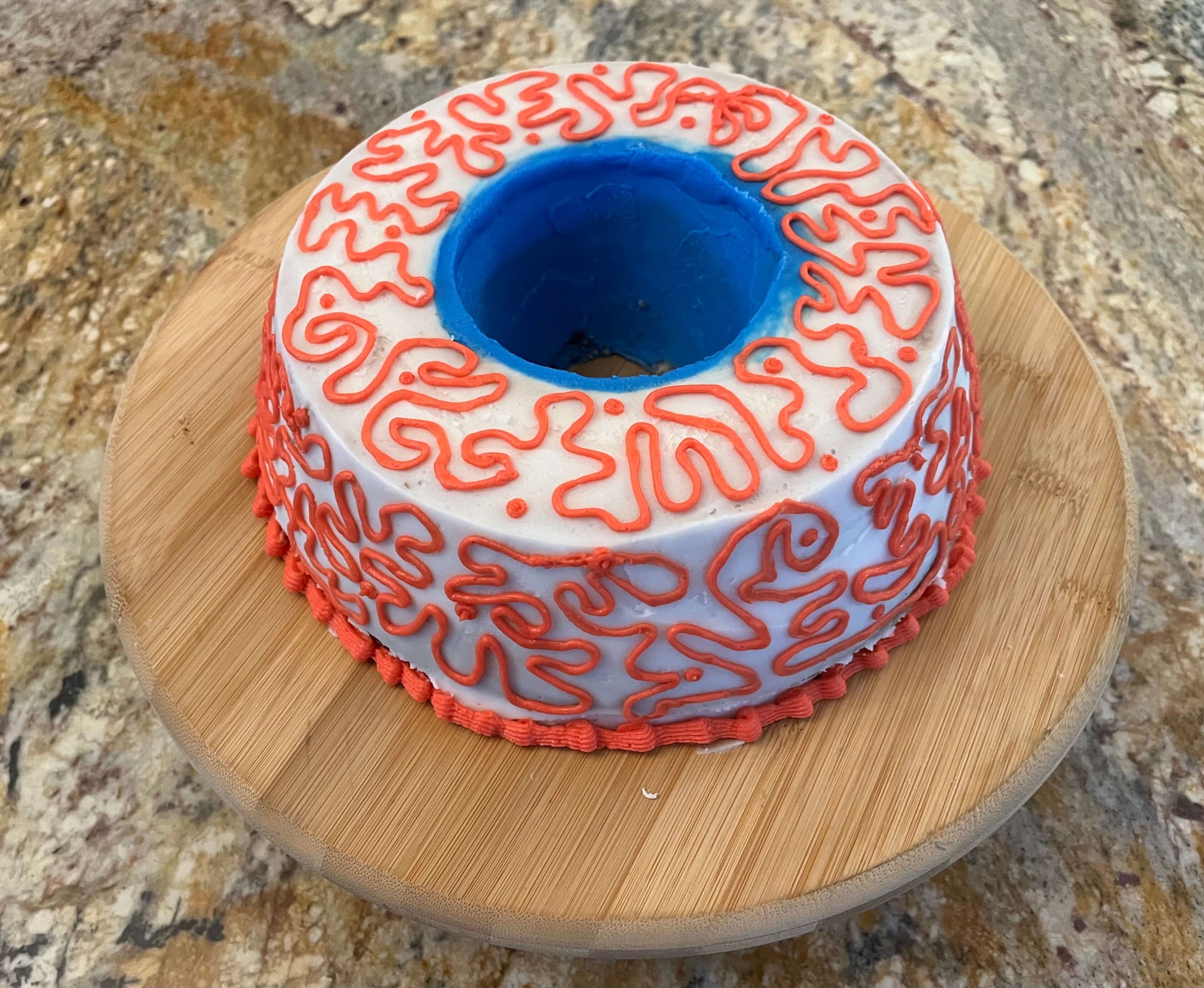 Decorated cake that looks like a blue bloodshot eyeball