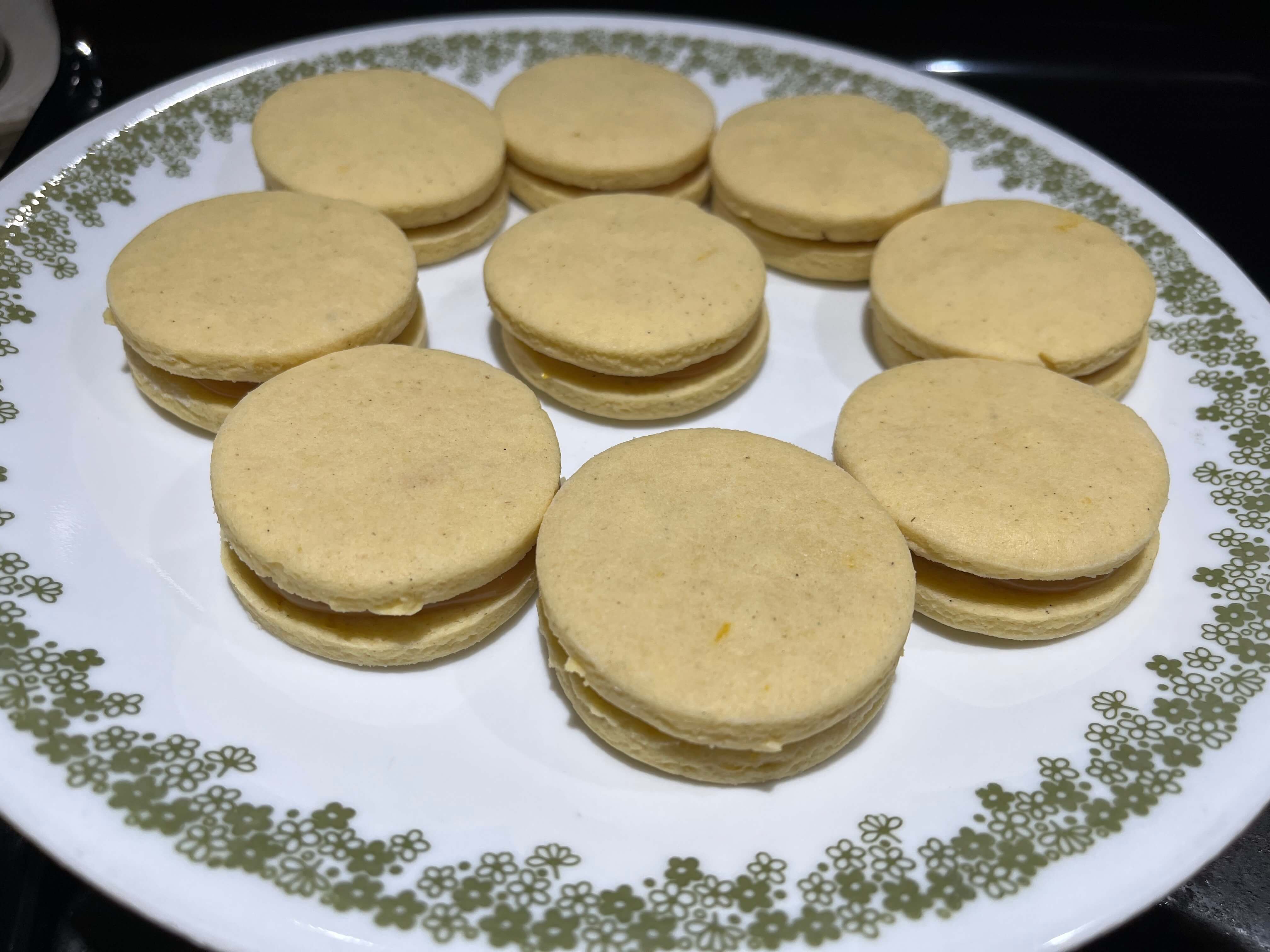 Pillowy soft alfajores cookies filled with dulce de leche and flavored with espresso, like a caramel latte.